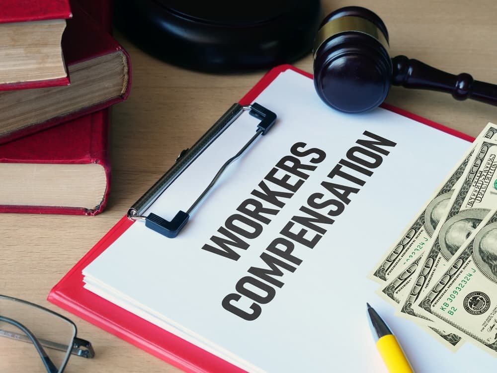 Workers compensation is shown using a text with money and gavel on the side