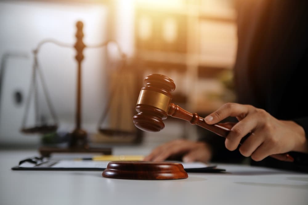 Workers' Compensation Lawyer in his office with gavel in hand