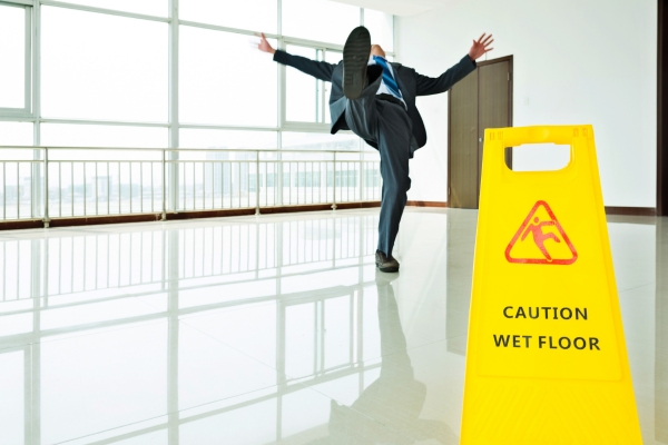 person slipping on wet floor