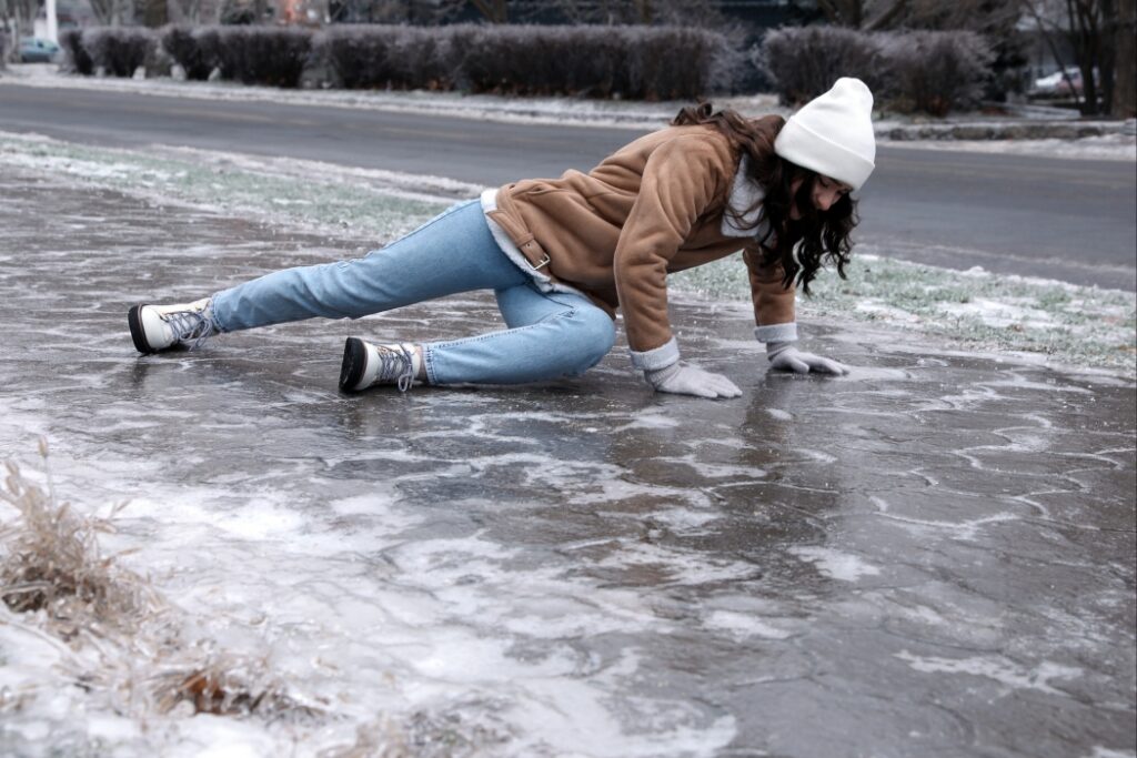 woman falling on slippery ice