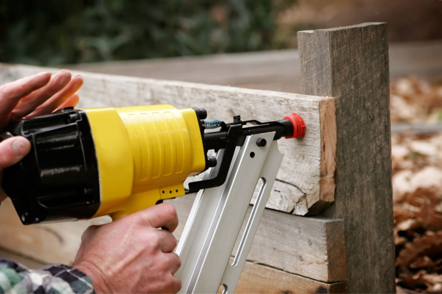 man using nailgun
