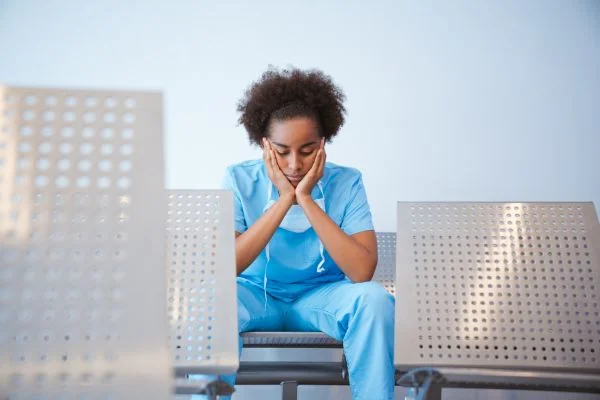 Fatigued hospital nurse after error