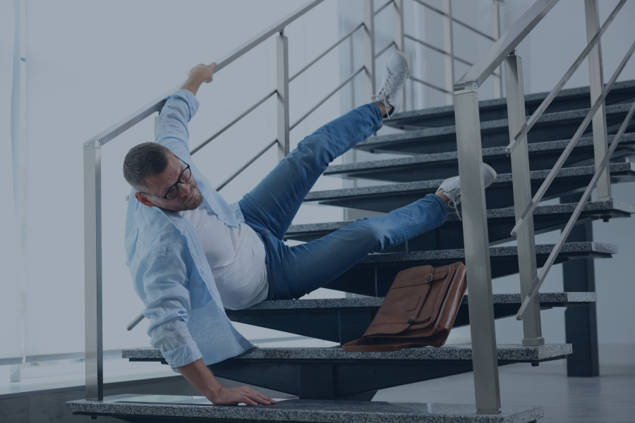man falling down uneven stairs